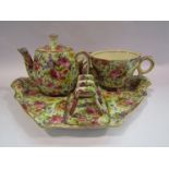 A Royal Winton floral design breakfast set on tray including toast rack, teapot etc.