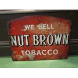 An enamel sign; We Sell Nut Brown Tobacco,