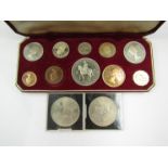 A 1952 Queen Elizabeth III coronation uncirculated coin set in red presentation box and two fine