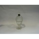A crystal bottle with silver collar and stopper,