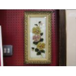 A pair of Edwardian gilt framed paintings of flowers on glass, 29cm x 11.