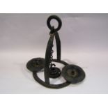 A wrought iron hanging candelabra,