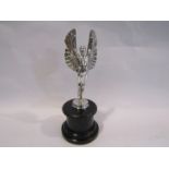 A reproduction winged Icarus car mascot,