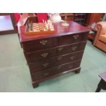 A George III mahogany chest of two short over three graduating long drawers on bracket feet,