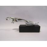 A reproduction small leaping Jaguar car mascot,