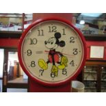 A Mickey Mouse wall clock,