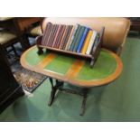 A mahogany occasional table with green leather inserts