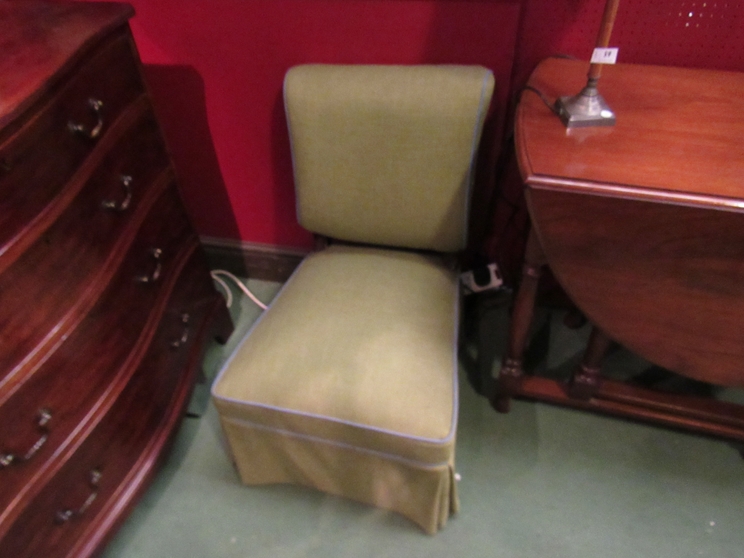 An ebonised and walnut late Victorian open armchair on ceramic castors