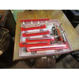 A collection of Wilbec red plastic and chrome cabinet handles and fittings