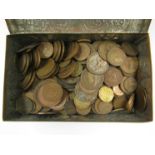 A tin containing British copper coinage