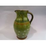 A Millhouse pottery jug, Harleston, Alan Frewin hand thrown, green slip, four pints,