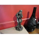 A bronzed figure of embracing couple,