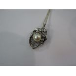 A white gold pendant/brooch set with single pearl, 8mm, unmarked 3.5cm drop, hung on chain, 5.