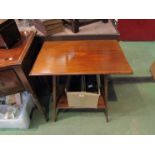 An Edwardian mahogany two tier occasional table with inlaid top,