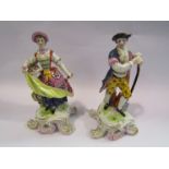 A pair of Derby porcelain "Red Crown" gardener figures,