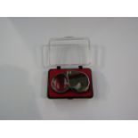 A 30x metallic jeweller's loupe,