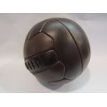 A reproduction vintage brown leather football