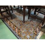 A pale blue foliate design rug,