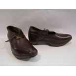 A vintage pair of brown leather and wood ladies clogs,