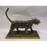 An Esteva of Barcelona lioness on marble plinth a/f, plaster with metal finish. Repaired tail.