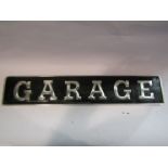 An aluminium 'Garage' sign,