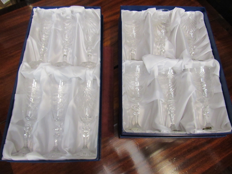 A boxed set of six crystal champagne glasses,