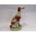 A Staffordshire seated Spaniel,