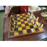 A chess board and chess pieces a/f