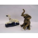 A Staffordshire spill vase as a dalmation and an elephant figure