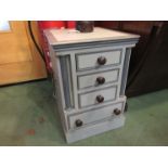 A painted four drawer bed side chest,