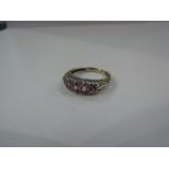 An 18ct pink sapphire and diamond half hoop ring