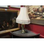 A brass table lamp with shade,