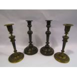 A pair of early 19th Century gilt candlesticks,
