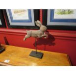 A wooden rabbit on stand,