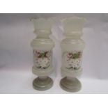 A pair of hand painted glass vases,