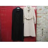 A 1970's Dorothy Rose black tailored wool full length cape and a Baccarat cream wool coat with belt,