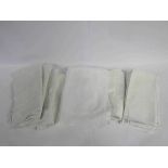 A box containing a quantity of white napkins sound damask and embossed woven pillow cases etc