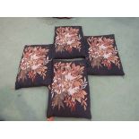 Four brown woven tapestry style rectangular cushions with tasseled corners,