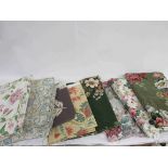 A box containing Arthur Sanderson's fabrics and curtains