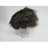 A brown fox fur hat