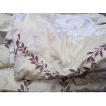 A pair of Designers Guild lime ground silk curtains, floral sprays with silver thread,