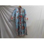 A pale blue Chinese silk dressing gown, multi coloured floral pattern,