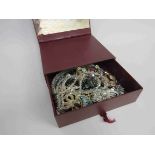 A small box of vintage costume jewellery, glass faceted beads,