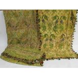 A pair of Victorian stylised floral curtains with tassel trim and a single curtain