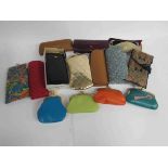 A small box containing assorted retro hard case and fabric glasses cases including Liberty,