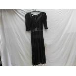 A Jean Muir iconic 1970's black rayon jersey full length dress with chocolate brown leather V neck