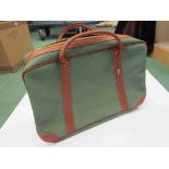 A 1960's/70's classic green canvas and tan leather gent's holdall (boxed)