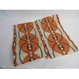 A pair of 1950's orange curtains circular disc pattern