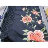 A small black piano shawl with floral embroidery