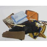 A quantity of fine leather gloves and silk scarves and a glove stretcher